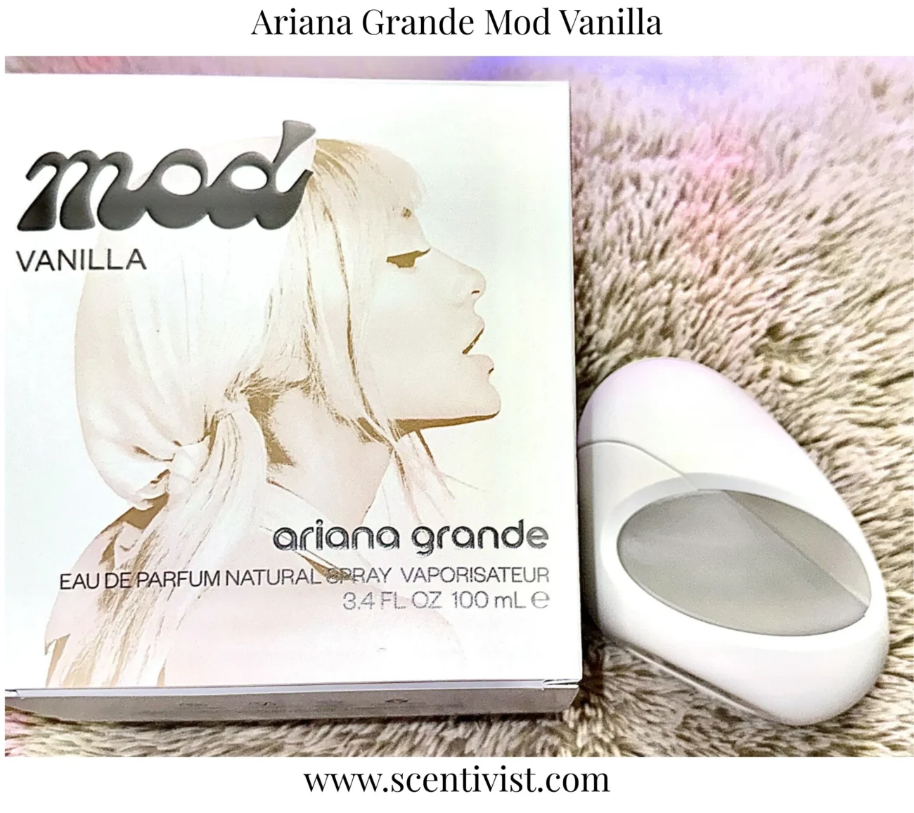 Mod Vanilla Eau de Parfum by Ariana Grande perfume box displayed beside its white oval bottle case on a soft textured surface.