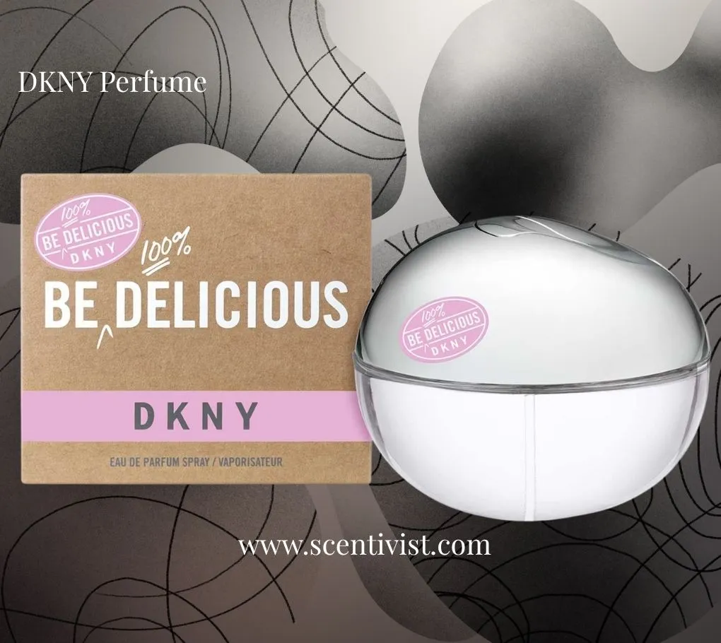 DKNY Be Delicious perfume bottle with matching box, featuring a sleek silver apple-shaped design and soft pink accents.
