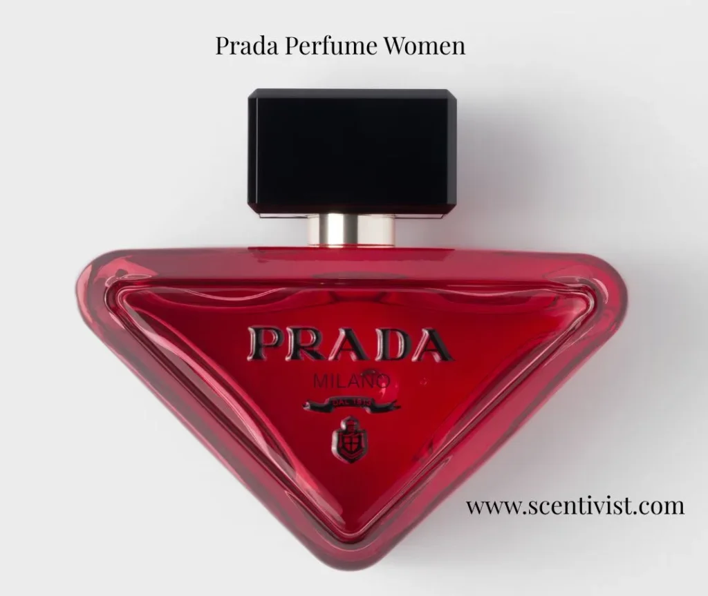 Prada Perfume Women: Paradoxe Intense perfume in a bold red, triangular glass bottle with a black cap on a clean background.