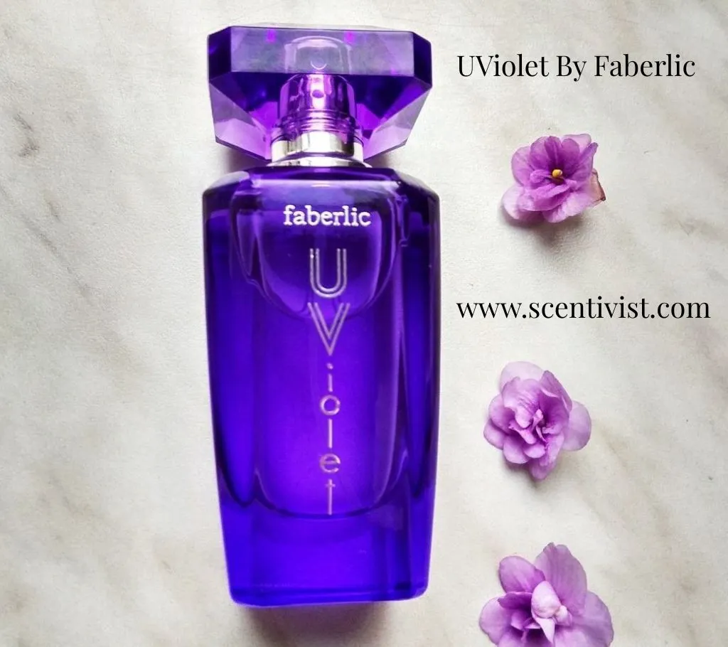 Bottle of UViolet perfume by Faberlic in a deep purple glass design with floral accents.